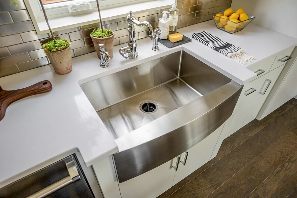 black stainless steel sink with white countertop